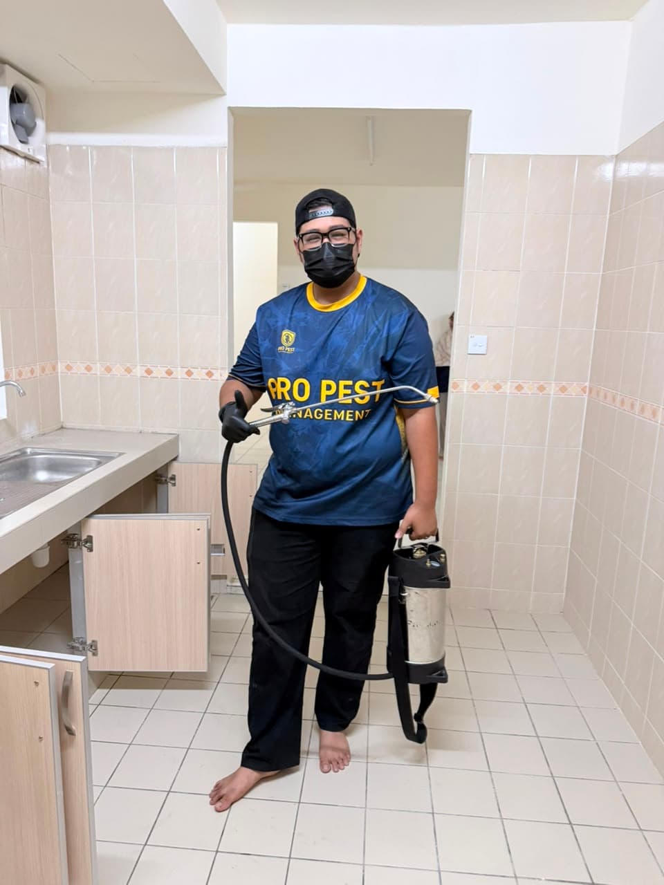 Pest control worker applying treatment
